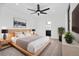 Bright bedroom with a comfortable bed, modern decor, and ample natural light features neutral tones and plant accents at 1252 Yates St, Denver, CO 80204