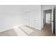 Bright bedroom featuring neutral carpet, large closet with sliding doors and a doorway to the bathroom at 1252 Yates St, Denver, CO 80204