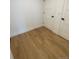 Bright bedroom with light hardwood floors and closets at 1252 Yates St, Denver, CO 80204