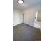 Spacious bedroom with grey carpet and double sliding doors at 1252 Yates St, Denver, CO 80204