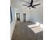 Spacious bedroom with carpet, ceiling fan and large closet at 1252 Yates St, Denver, CO 80204