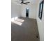 Bright bedroom with carpet, ceiling fan, and access to bathroom at 1252 Yates St, Denver, CO 80204