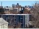 A long range view of the city skyline from a residential neighborhood at 1252 Yates St, Denver, CO 80204