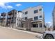 Contemporary townhomes featuring clean lines, dark window frames, and a modern aesthetic at 1252 Yates St, Denver, CO 80204