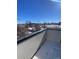 Snowy rooftop deck with city views at 1252 Yates St, Denver, CO 80204