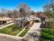 Aerial view of a single-Gathering home with a well-manicured lawn and a long driveway at 2562 S Xavier St, Denver, CO 80219
