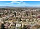 Expansive aerial view of a residential neighborhood with mountain views in the distance at 2562 S Xavier St, Denver, CO 80219