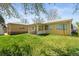 A spacious backyard features a covered porch and a well-maintained lawn at 2562 S Xavier St, Denver, CO 80219