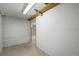 Unfinished basement section shows utility pipes and access to other areas at 2562 S Xavier St, Denver, CO 80219