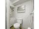 Cozy bathroom featuring a toilet, vanity, and mirrored medicine cabinet at 2562 S Xavier St, Denver, CO 80219