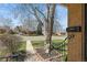 Close-up of the front porch showcases brick detailing and a metal railing at 2562 S Xavier St, Denver, CO 80219