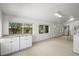 Bright sunroom with large windows and access to back yard at 2562 S Xavier St, Denver, CO 80219