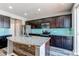 Modern kitchen with large island and granite countertops at 4765 S Netherland St, Centennial, CO 80015