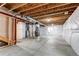 Unfinished basement with high ceilings and ample storage space at 4765 S Netherland St, Centennial, CO 80015