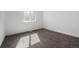 Bright bedroom with neutral carpet, white walls, and natural light from a window at 17486 E Plateau Dr, Aurora, CO 80015