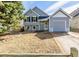 Charming two-story home with inviting curb appeal, a well-manicured lawn, and an attached garage at 17486 E Plateau Dr, Aurora, CO 80015