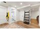 Finished basement with a ladder shelf and space leading to a bathroom at 37625 Pheasant Run, Elizabeth, CO 80107