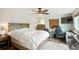 Cozy main bedroom includes a ceiling fan, desk, and natural light at 37625 Pheasant Run, Elizabeth, CO 80107
