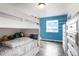 bedroom with a bunk bed, hard wood floors, and shelving unit with a view at 37625 Pheasant Run, Elizabeth, CO 80107