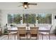 Bright dining area with large windows offering beautiful views of the surrounding trees at 37625 Pheasant Run, Elizabeth, CO 80107