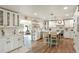 Beautiful kitchen featuring a center island, wood floors, and open dining area at 37625 Pheasant Run, Elizabeth, CO 80107