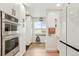 Bright eat-in kitchen with built-in oven, pantry, window, and access to the backyard at 37625 Pheasant Run, Elizabeth, CO 80107