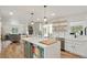 Modern kitchen with a center island, open floor plan, and stainless steel appliances at 37625 Pheasant Run, Elizabeth, CO 80107