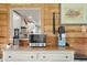 View to the modern kitchen with white cabinets from a cozy living area at 37625 Pheasant Run, Elizabeth, CO 80107