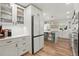 Spacious kitchen with stainless steel refrigerator and view to another kitchen area at 37625 Pheasant Run, Elizabeth, CO 80107
