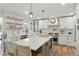 Contemporary kitchen with a large island, stainless steel appliances, and ample counter space at 37625 Pheasant Run, Elizabeth, CO 80107