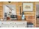 View to the modern kitchen with white cabinets from a cozy living area at 37625 Pheasant Run, Elizabeth, CO 80107