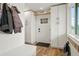 Mudroom features coat rack, custom cabinets, bench, and natural light at 37625 Pheasant Run, Elizabeth, CO 80107
