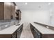 Basement bar with wine cooler, sink, cabinets, and countertop at 7392 Timberstone St, Castle Pines, CO 80108