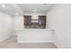 Basement bar area featuring tiled backsplash, cabinets, and countertop at 7392 Timberstone St, Castle Pines, CO 80108