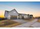 Street view of charming single-Gathering homes featuring 2-car garages and driveways at 7392 Timberstone St, Castle Pines, CO 80108