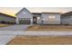 Charming single Gathering home featuring a 2-car garage and stone accents at 7392 Timberstone St, Castle Pines, CO 80108