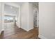 Hallway leading to a room with large windows offering lots of natural light at 7392 Timberstone St, Castle Pines, CO 80108