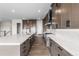 Modern kitchen with white countertops, stainless steel appliances, and hardwood floors at 7392 Timberstone St, Castle Pines, CO 80108