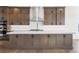 Modern kitchen with large island, custom cabinets, and stainless steel appliances at 7392 Timberstone St, Castle Pines, CO 80108