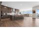 Modern kitchen with island, stainless steel appliances, and a dining area at 7392 Timberstone St, Castle Pines, CO 80108