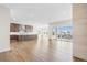 Bright, spacious living room with hardwood floors and sliding glass doors to the patio at 7392 Timberstone St, Castle Pines, CO 80108