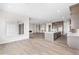Spacious living room with hardwood floors, a fireplace, and an open floor plan at 7392 Timberstone St, Castle Pines, CO 80108