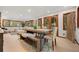 Open dining and living room with expansive windows and rustic wood table with seating at 8821 Blue Creek Rd, Evergreen, CO 80439