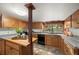 Kitchen with oak cabinets, granite countertops and view to backyard at 8821 Blue Creek Rd, Evergreen, CO 80439