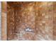 Tiled shower featuring a built-in bench, offering a luxurious and relaxing experience at 8821 Blue Creek Rd, Evergreen, CO 80439