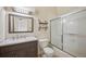 Updated bathroom with a vanity and shower with glass doors at 18080 Becket Dr, Parker, CO 80134