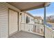 Condo front door opens to private deck area with railings at 18080 Becket Dr, Parker, CO 80134