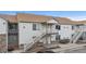 Two-story condo building with individual entrances and staircases at 18080 Becket Dr, Parker, CO 80134