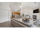 Open-concept living area with high ceilings, a fireplace, and a view of the kitchen at 18080 Becket Dr, Parker, CO 80134