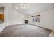 Bright and airy living room featuring a fireplace and large windows at 18080 Becket Dr, Parker, CO 80134